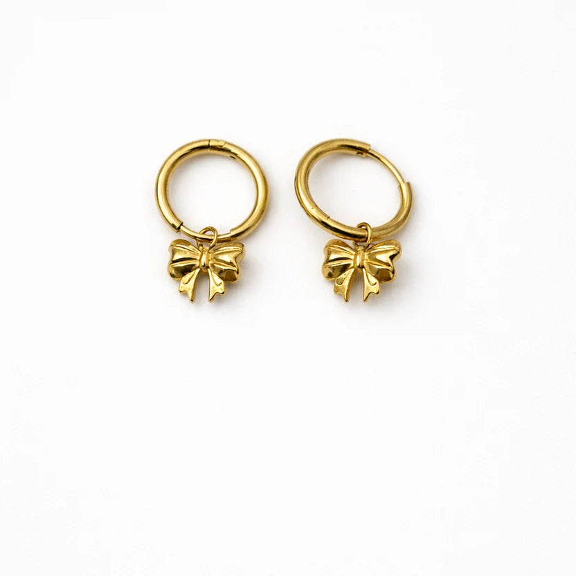 Gold-tone hoop earrings with bow charms